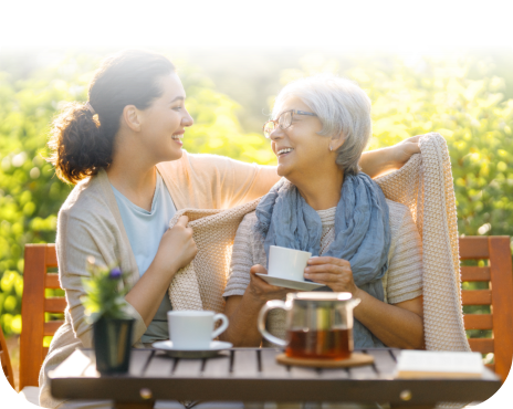 Woman smiling at the senior woman