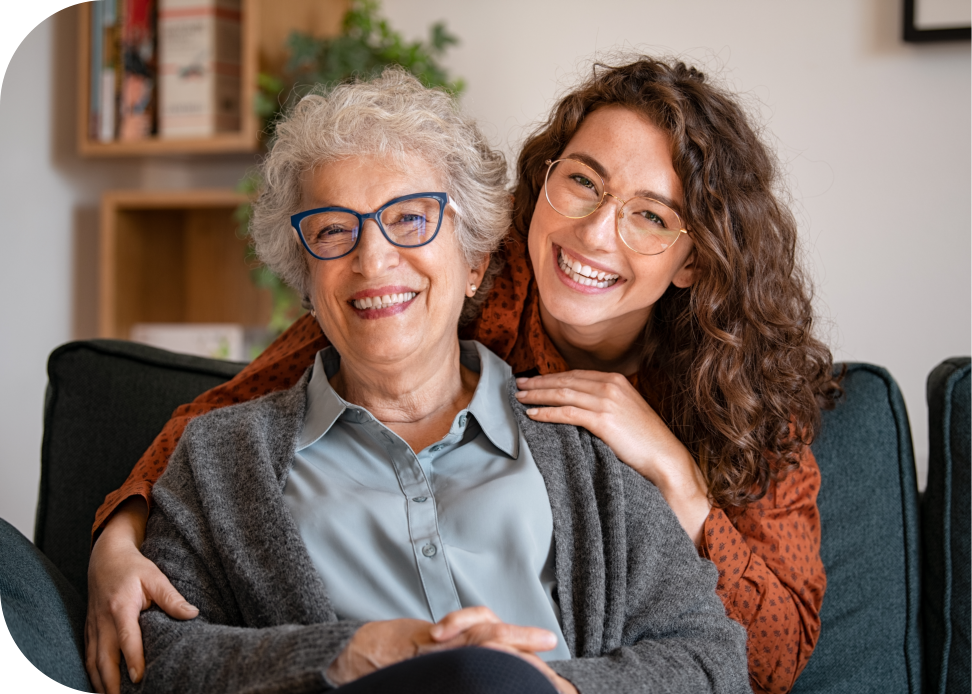 woman and senior woman smiling