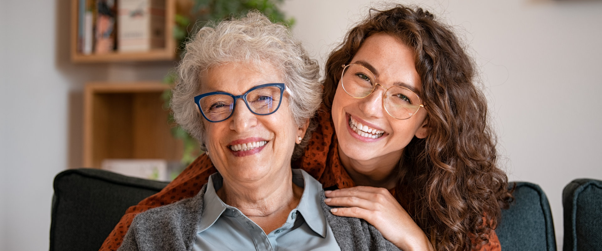 woman and senior woman smiling