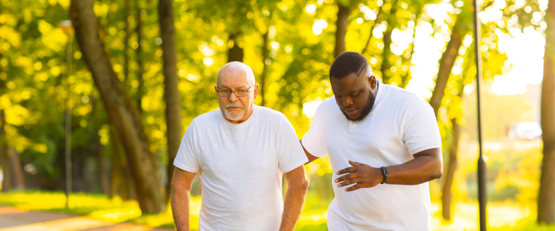 man and senior man walking together