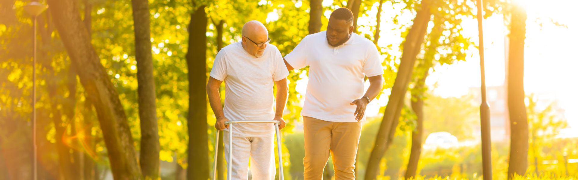 senior man and man walking outside