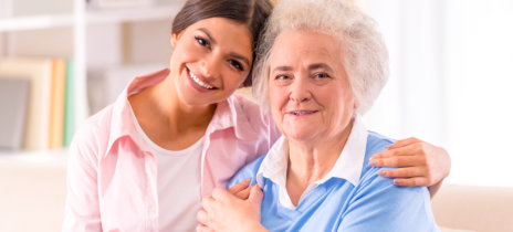 woman and senior woman smiling