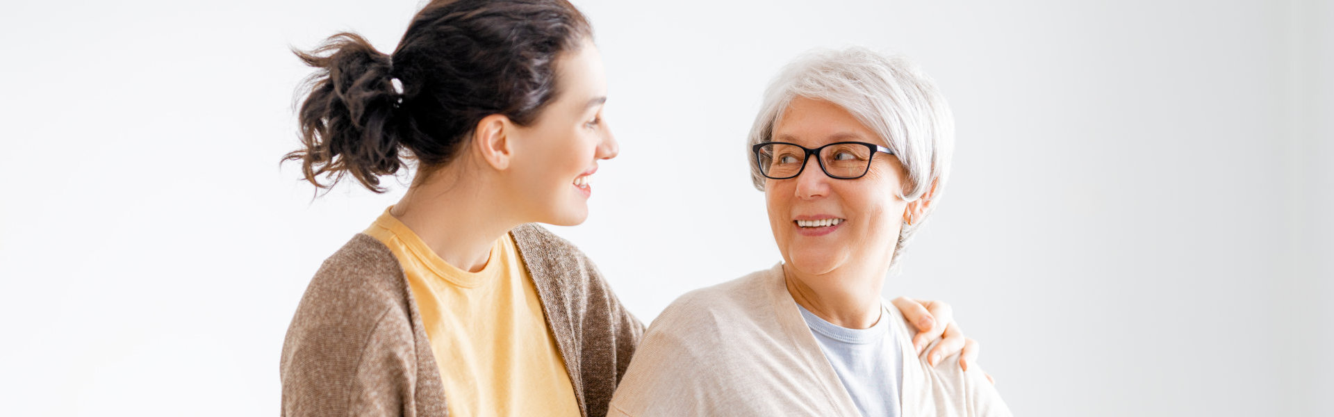 senior woman smiling at the woman