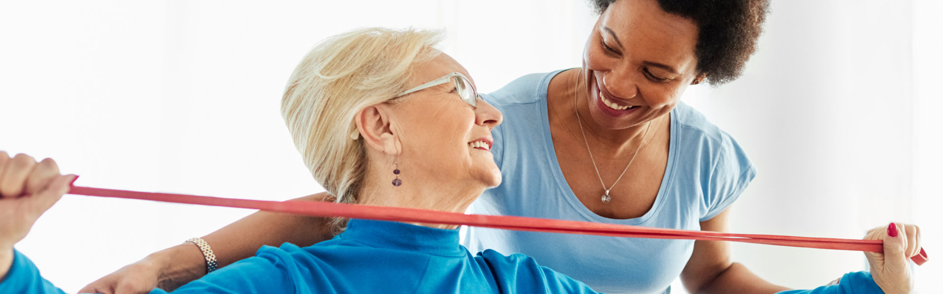 woman and senior woman smiling